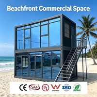 Conteneur modulaire démontable, Cottage de bord de mer avec terrasse ensoleillée et mur en verre, Boutiques préfabriquées, Bar modulaire moderne à 2 étages