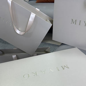Custom Logo Hot <b>Stamped</b> Durable Paper Gift Bag for Clothing Cosmetics and Perfume Promotion with <b>Hand</b> Length Handle - Product Image 1