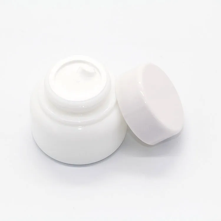 फेस लोशन पैकेजिंग के लिए सफेद चीनी मिट्टी की गोल बोतल ग्लास जार निर्माता