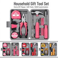 Ensemble d'outils ménagers roses avec pinces, tournevis, ruban à mesurer, clés hexagonales, marteau pour usage domestique