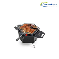 Barbecue portable hexagonal au charbon de bois noir mat avec trépied, grille en fil métallique et poignées latérales pour feu de camp