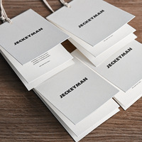 Étiquettes de vêtements pliées personnalisées avec impression de logo pour hommes et femmes