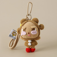 Un produit artisanal populaire : un sac mignon en crochet avec une poupée à double tête et une poupée à tête unique