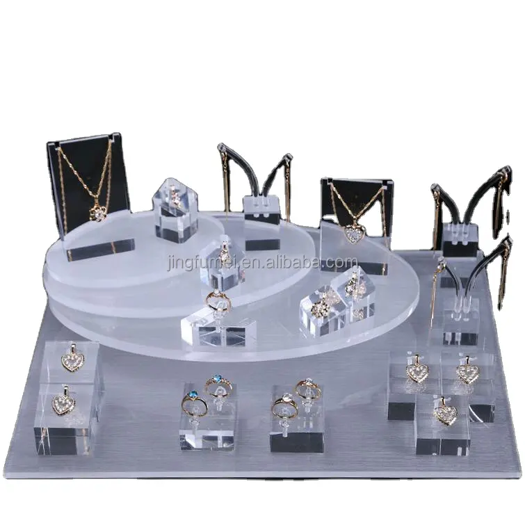 Juego de accesorios de exhibición de joyería acrílica personalizada, soporte de exhibición de ventana de joyería transparente de lujo moderno para tienda