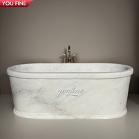 Baignoire de luxe YOUFINE en marbre blanc, sculptée à la main, ronde, pour salle de bain d'hôtel haut de gamme et suite principale de villa