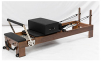 Machine de Pilates Reformer en bois de noyer de luxe pour la rééducation, la physiothérapie, équipement de studio de Pilates