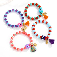 Bracelet Bohème Multicouche pour Femme avec Breloque Pompon Œil Porte-Bonheur et Perles de Cristal, Plaqué Or, Style Océan, Bijou de Plage