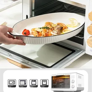 Plat de cuisson moderne <span class=keywords><strong>en</strong></span> céramique blanche avec doubles poignées et bord noir, plat ovale <span class=keywords><strong>en</strong></span> <span class=keywords><strong>porcelaine</strong></span> pour poisson, pâtes, salade, hôtel, restaurant - Product Image 6