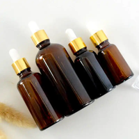 En stock flacon d'huile essentielle de 10 ml/flacons compte-gouttes en verre ambré à l'épreuve des enfants pipette de 10 ml