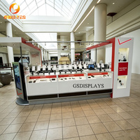 Idées de design pour la décoration de magasins de téléphonie mobile : Kiosque rouge et blanc avec présentoir pour téléphones pour centre commercial