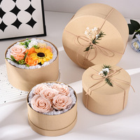 Boîte ronde en papier kraft esthétique de luxe avec estampage de logo personnalisé pour arrangements floraux haut de gamme