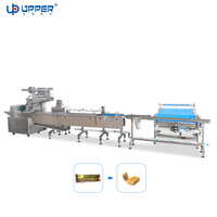 Machine d'emballage pour barres protéinées, barres alimentaires et rouleaux suisses enrobés de chocolat