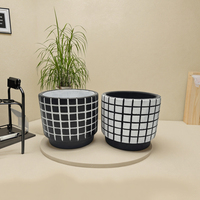 Elégant pot de fleurs irrégulier en ciment noir et blanc à motifs design classique simple pour jardin intérieur ou article décoratif pour la maison