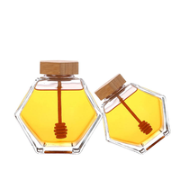 Bocaux en verre hexagonaux de haute qualité de 100 ml, 220 ml et 380 ml avec couvercles en bois pour le stockage du miel, des bonbons et du sucre