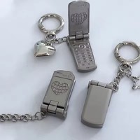 Pendentif rotatif miniature à rabat pour téléphones mobiles. Porte-clés décoratif pour cadeau.