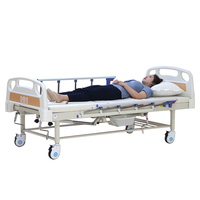 Lit médical manuel avec toilettes intégrées pour soins hospitaliers et à domicile des patients paralysés