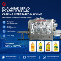 Machine intégrée de remplissage et de bouchage à double tête avec suivi servo et convoyeur pour la production de remplissage de bouteilles de liquides
