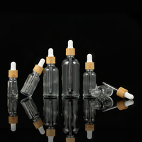 Natürliche Bunte Glasfläschchen 50ml Klare Ätherische Öl-Flaschen mit Mattiertem Bambusdeckel und Tropfer