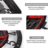 Horloge ronde créative en fer de 25 cm avec un design avant-gardiste