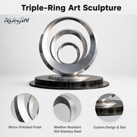 Sculpture d'art en acier inoxydable poli miroir, anneaux concentriques multicouches imbriqués, pour espace public extérieur, fabrication sur mesure