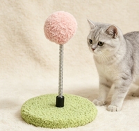 Jouet vertical à ressort pour chat, balle rose douce et moelleuse avec base en peluche verte pour l'amusement et la stimulation des chatons en intérieur