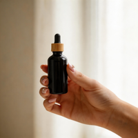 Flacons compte-gouttes en verre noir premium 15ml 30ml 50ml 100ml avec bouchons en bambou pour huiles essentielles