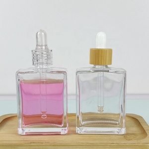 Hot Selling Cosmetic Rectangular <b>Bottle</b> Pink Silk Screen logo 50ml 100ml Essential Oil <b>Bottle</b> with Gold Aluminum <b>Dropper</b> Cap - Product Image 5