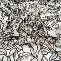 Tissu en dentelle brodé au laser à deux couleurs, motif feuille, de haute qualité, en stock usine, à prix abordable, pour vêtements, échantillon gratuit disponible