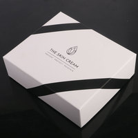 Boîtes d'emballage élégantes personnalisées d'ensemble de soins de la peau en papier carton noir et blanc pour l'emballage de produits de soin