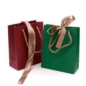 Professional Customized Coated Paper Jewelry Packaging Paper Bag with Ribbon Handle - Product Image 1