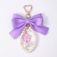 Nouveau porte-clés nœud pour femme, avec ruban en satin, breloque perle, anneau porte-clés, pendentif fleur émaillée pour sac, accessoires de sac à main style coréen