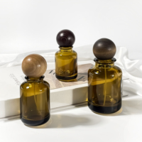 Pompe de pulvérisation vide en gros 30ml 50ml 100ml cylindre rond emballage cosmétique huile essentielle brun bouteille de parfum de luxe