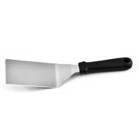 Tourne-steak / Spatule résistant à la chaleur avec manche noir