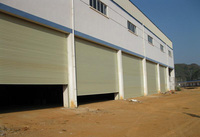 Porte industrielle à enroulement en aluminium haute résistance au vent, design minimaliste, pour entrepôt extérieur