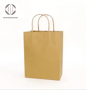 Sacchetto di carta Kraft con manico borsa Tote natalizia/sacchetto regalo/pacchetto marrone stampa Logo OEM stampa flessografica dimensioni personalizzate riciclabili