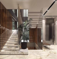 Escalier droit sur mesure de luxe, fabriqué avec des accents en nickel brossé et des marches larges, pour les lofts résidentiels haut de gamme