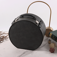 Étui de transport rond haut de gamme personnalisé avec logo et serrure, boîte de rangement ronde en cuir PU à marque privée pour emballage cadeau de marque