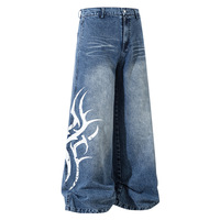 Jean baggy taille haute imprimé tribal, denim délavé et déchiré, coupe large, style Y2K streetwear, pantalon skater respirant et décontracté