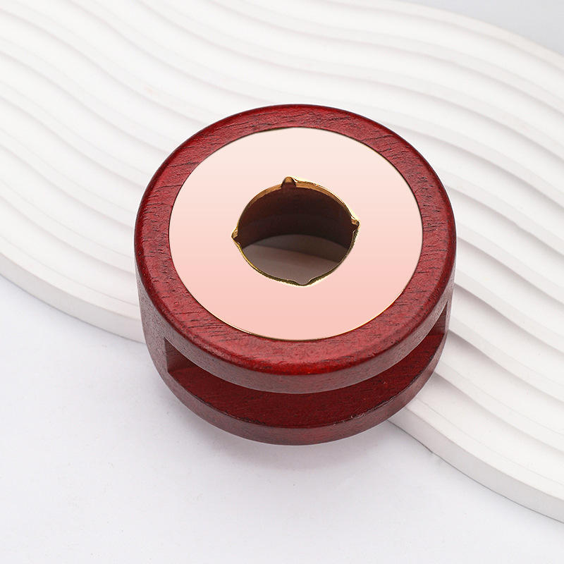 Poêle rouge-brun à trou rond en or rose