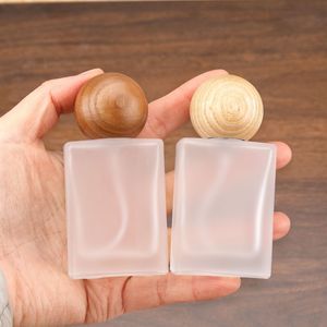 30ml Screw Mouth Perfume Subpackage <b>Bottle</b> Portable Square Flat Glass <b>Spray</b> <b>Bottle</b> Refillable <b>Empty</b> <b>Bottle</b> with Walnut Wood Cap - Product Image 1