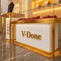 Vitrine de luxe V-Done pour bijoux, en acier inoxydable doré et verre, comptoir d'exposition commercial pour bijouterie