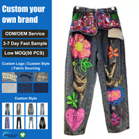 Jean en denim délavé vintage pour femme, avec motif floral à sequins colorés, déchiré et vieilli, coupe ample à jambe large