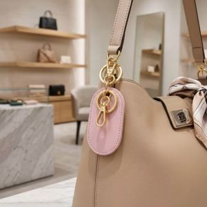 Porte-clés ovale en cuir PU gravable multicolore, breloque de sac minimaliste, cadeaux promotionnels - Product Image 3