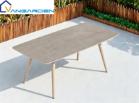 Ensemble table et chaises en pierre frittée moderne et durable, résistant aux UV, empilable, imperméable et résistant aux intempéries pour villas, hôtels et jardins
