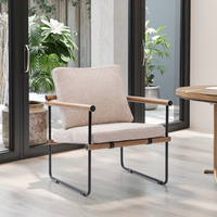 Fauteuil individuel moderne capitonné avec dossier ailé et repose-pieds, structure métallique, idéal pour salle à manger, bureau et salon - Vente en gros usine