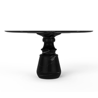 Table à manger ronde en marbre noir de luxe avec base sculpturale artisanale pour une élégance intérieure et extérieure