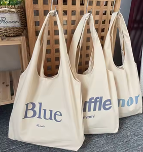 Bolsa de compras reutilizable de lona de algodón ecológica al por mayor con logo personalizado impreso en ella - Product Image 1