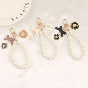 Nouveau arc porte-clés pendentif mignon perle chaîne beauté tête métal rond étiquette accessoires sac décoration - Product Image 2