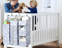 Organisateur de couches suspendu 3-en-1 pour table à langer, organisation de la chambre d'enfant et rangement mural pour couches de berceau