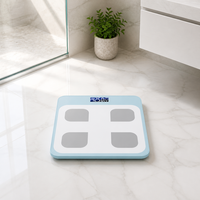 Balance connectée Bluetooth intelligente avec écran LCD en verre trempé bleu clair et affichage de la température pour un pesage corporel précis à domicile